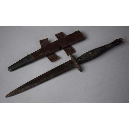 115 - A WWII Commando Dagger with Leather Scabbard, Blade Tip Missing