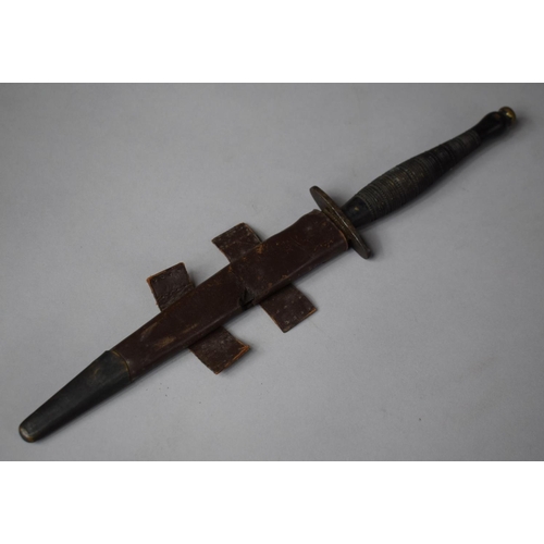 115 - A WWII Commando Dagger with Leather Scabbard, Blade Tip Missing