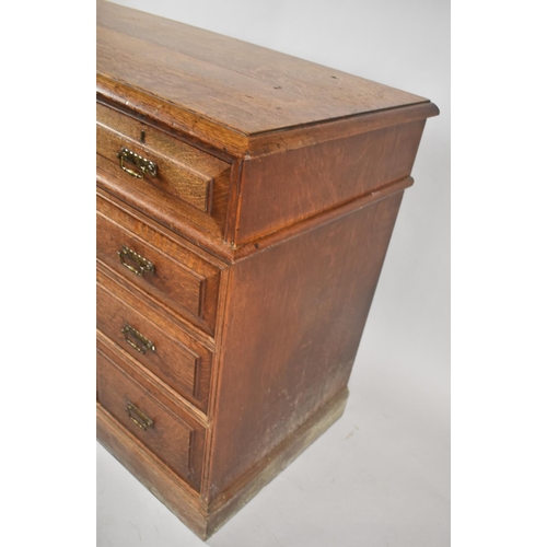 68 - An Edwardian Oak Kneehole Writing Desk with Three Top Drawers, Kneehole flanked by Three Graduated S... 