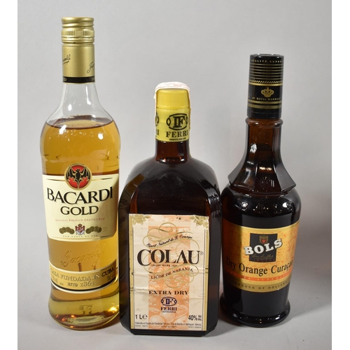 78 - A Bottle of Bacardi Gold Rum, Kolau Orange Liqueur and Orange Curacao