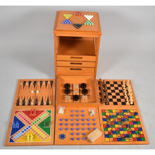 87 - A Modern Wooden Games Compendium Cabinet with Pull Out Slides and Four Drawers, Complete with Pieces... 