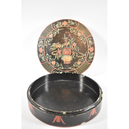 90 - A Chinese Lacquered Box with Floral Decoration in Relief to Lid, 26cm Diameter