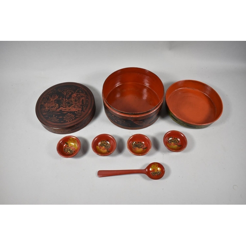 91 - An Oriental Circular Lacquered Food Box with Inner Bowl, Spoon and Four Small Bowls, 18cm Diameter