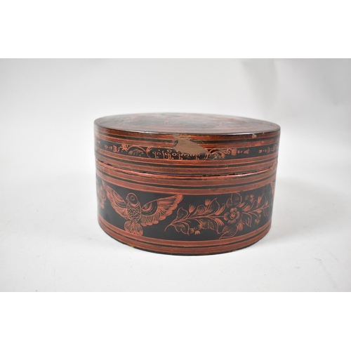 91 - An Oriental Circular Lacquered Food Box with Inner Bowl, Spoon and Four Small Bowls, 18cm Diameter