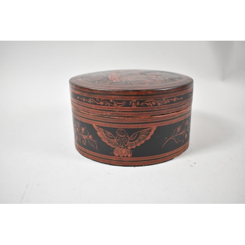 91 - An Oriental Circular Lacquered Food Box with Inner Bowl, Spoon and Four Small Bowls, 18cm Diameter