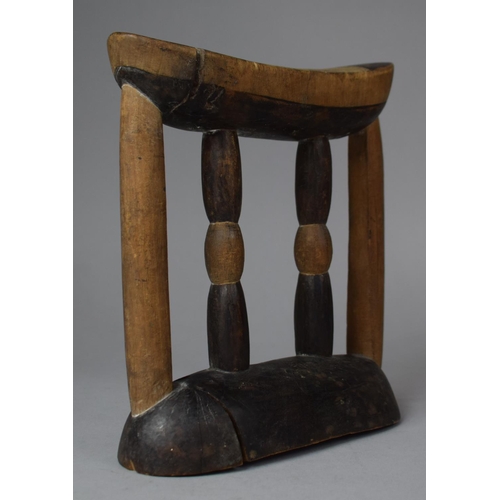 94 - An African Headrest/Pillow with Turned Centre Supports, 19cm wide and 21cm high