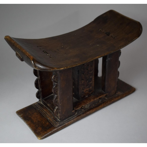 95 - A 19th Century African Ashanti Carved Wooden Stool with Pierced Decoration, 42cm wide