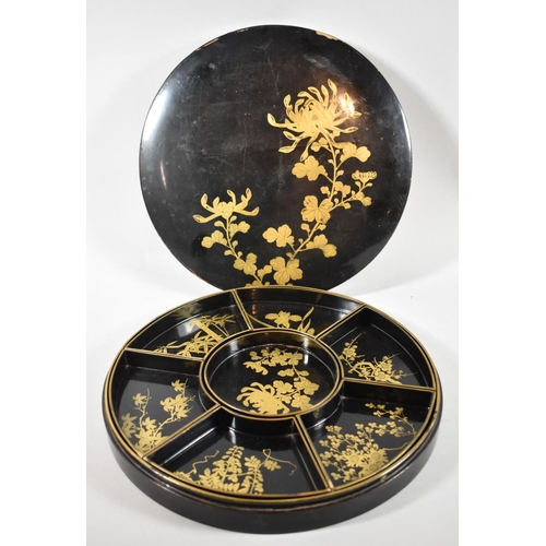 96 - A Circular Lacquered Chinese Hors d'oeuvres Dish and Cover with Seven Removable Trays, Gilt Decorati... 