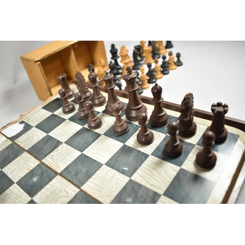 42 - A Folding Plastic Chessboard and Piece Set, a Box Wood Small Set of Chess Pieces and a Cased Set of ... 
