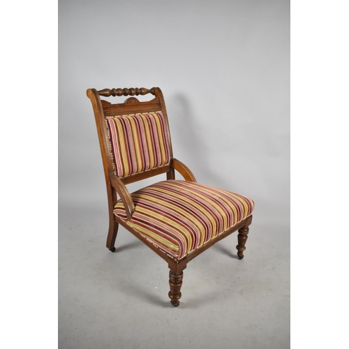 550 - An Edwardian Walnut Framed Ladies Nursing Chair with Striped Velvet Upholstery