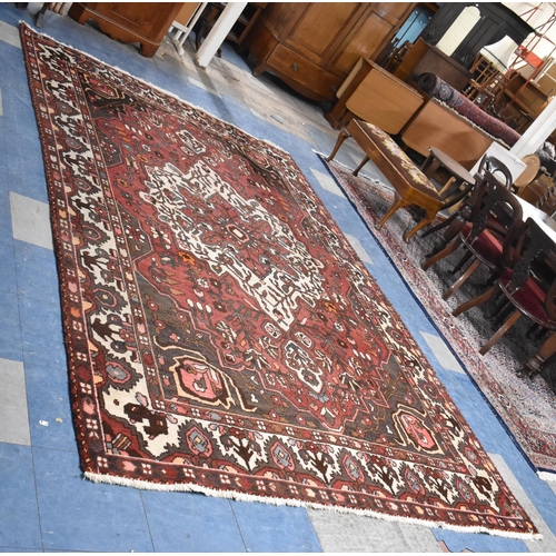 556 - A Rectangular Patterned Woollen Rug, 317x209cm