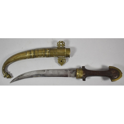 64 - A Persian Wooden Handled Curved Blade Dagger with Brass Scabbard, 39cm long