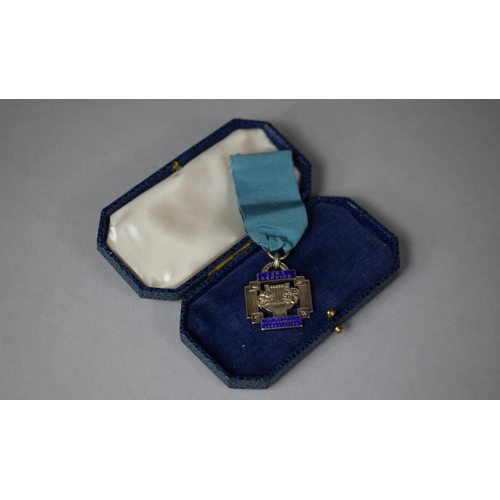 70 - A Cased Silver and Enamel Medal for Long Service, The National Operatic and Dramatic Association