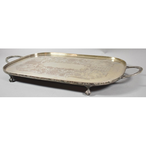 75 - A Mid 20th Century Silver Plated Two Handled Tray on Four Claw Feet, 57cm Long