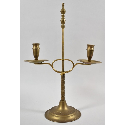 11 - A Brass Reproduction Rise and Fall Two Branch Candelabra, 39cm high