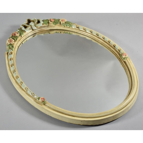 278 - A Moulded Oval Framed Wall Mirror with Floral and Spiralled Decoration, 53cm high