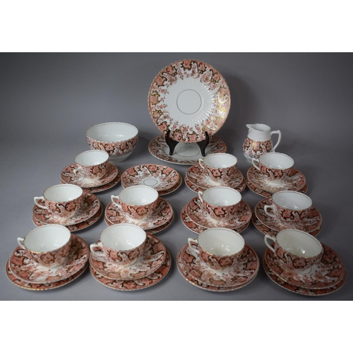 323 - A Imari Pattern Tea Set comprising Twelve Side Plates, Twelve Saucers, Two Cake Plates, Milk, Slop B... 