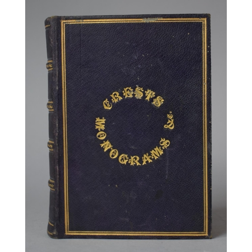 350 - A Leather Bound and Tooled Leather Album Containing Affixed and Loose Printed Crests and Monograms