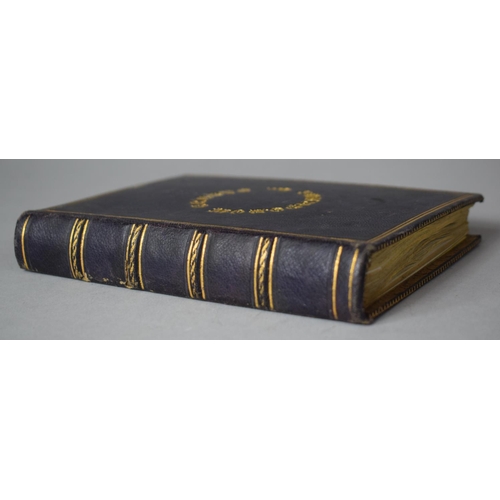 350 - A Leather Bound and Tooled Leather Album Containing Affixed and Loose Printed Crests and Monograms