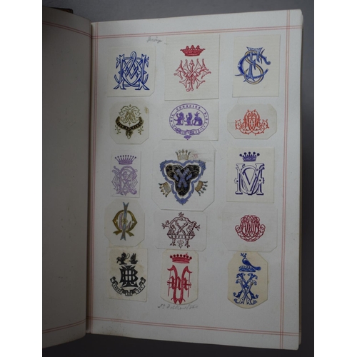 350 - A Leather Bound and Tooled Leather Album Containing Affixed and Loose Printed Crests and Monograms