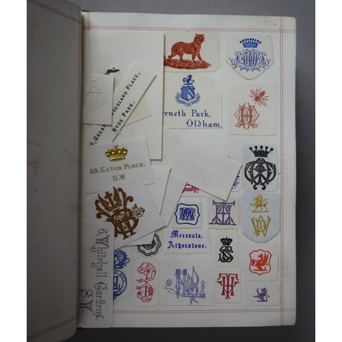 350 - A Leather Bound and Tooled Leather Album Containing Affixed and Loose Printed Crests and Monograms