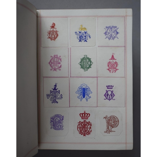 350 - A Leather Bound and Tooled Leather Album Containing Affixed and Loose Printed Crests and Monograms