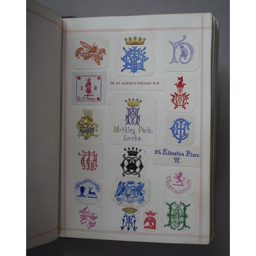 350 - A Leather Bound and Tooled Leather Album Containing Affixed and Loose Printed Crests and Monograms