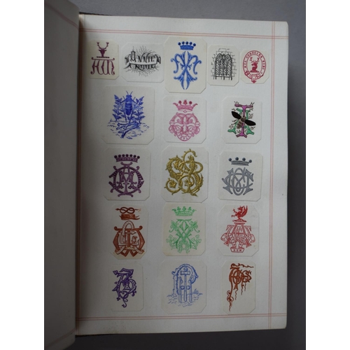 350 - A Leather Bound and Tooled Leather Album Containing Affixed and Loose Printed Crests and Monograms