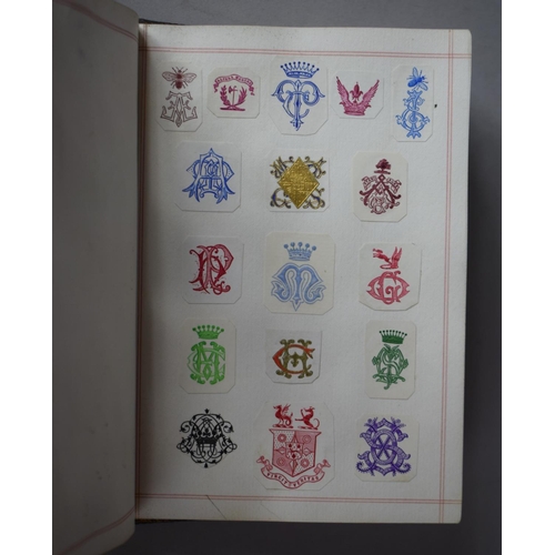 350 - A Leather Bound and Tooled Leather Album Containing Affixed and Loose Printed Crests and Monograms