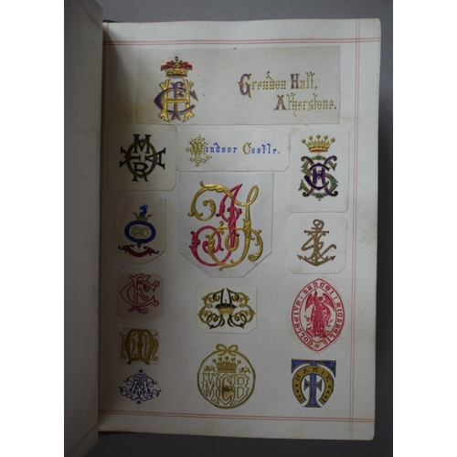 350 - A Leather Bound and Tooled Leather Album Containing Affixed and Loose Printed Crests and Monograms