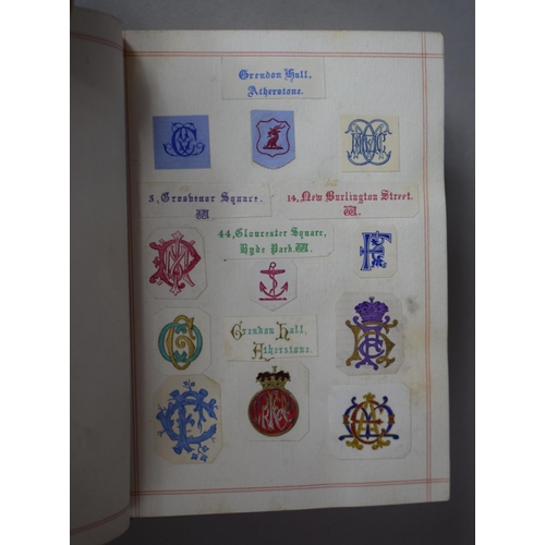 350 - A Leather Bound and Tooled Leather Album Containing Affixed and Loose Printed Crests and Monograms