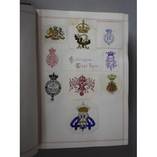 350 - A Leather Bound and Tooled Leather Album Containing Affixed and Loose Printed Crests and Monograms