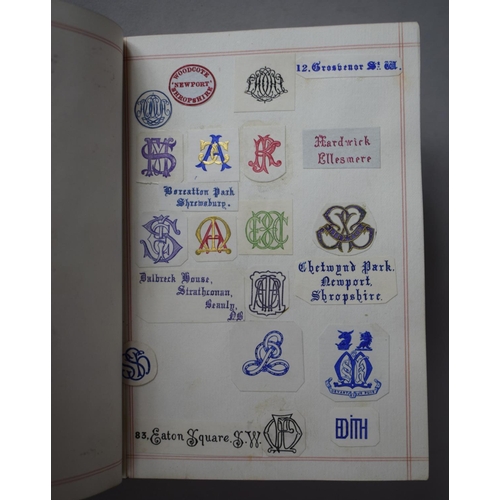 350 - A Leather Bound and Tooled Leather Album Containing Affixed and Loose Printed Crests and Monograms