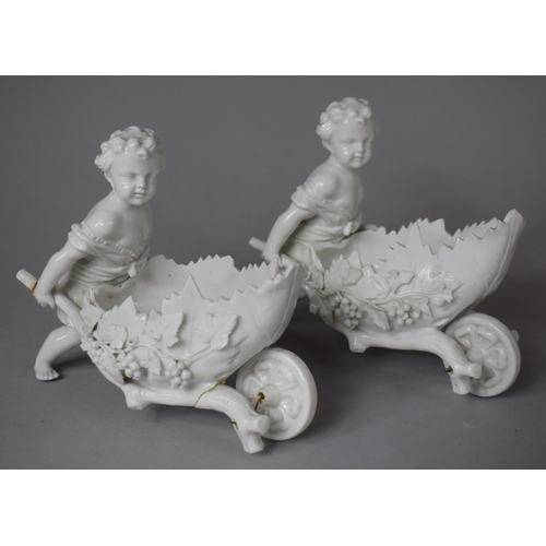 393 - A Pair of Continental Creamware Novelty Baskets in the  Form of Cherubs Pushing Vine Leaf and Grape ... 