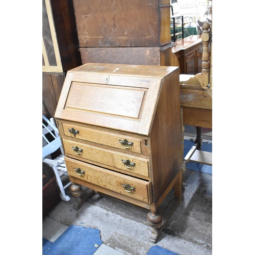 604 - A Mid 20th Century Oak Fall Front Bureau with Three Drawers, 71cm wide