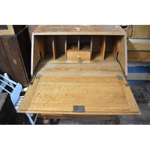 604 - A Mid 20th Century Oak Fall Front Bureau with Three Drawers, 71cm wide