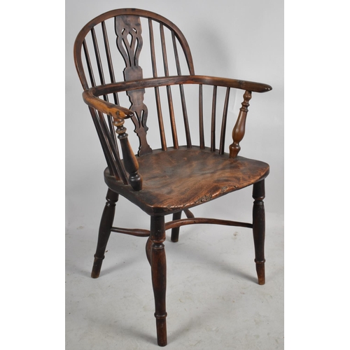 606 - An Early Yew Wood Windsor Hoop Back Armchair