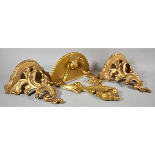 132 - A Pair of Moulded Gilt Composition Wall Sconces, Together with a Single Wooden Example, 25cm High