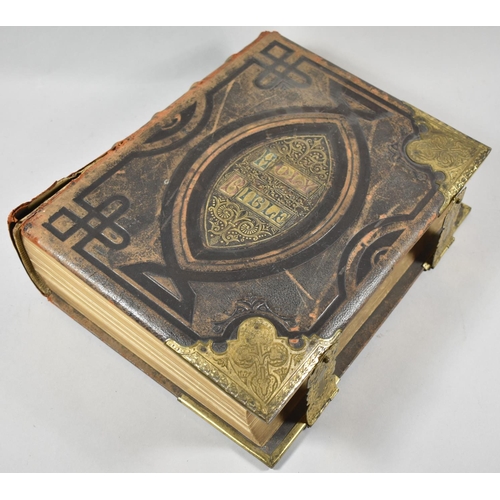 189 - A Brown's Self Interpreting Bible with Tooled Leather Binding Having Gilt Metal Clasps, 33cm high