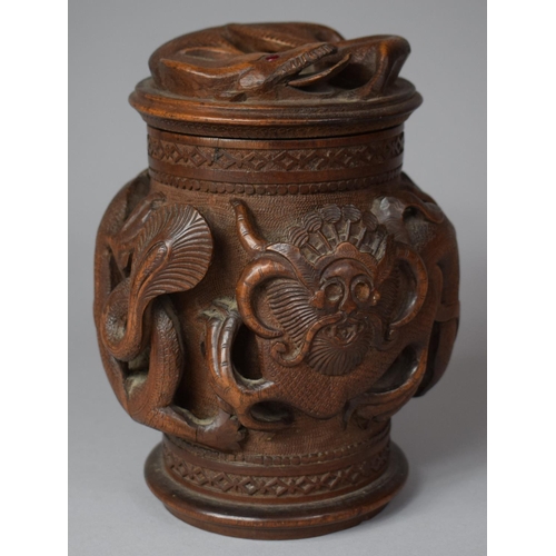 249 - A Carved Indonesian Wooden Tobacco/Caddy Box Decorated in High Relief with Dragons, 17cm high