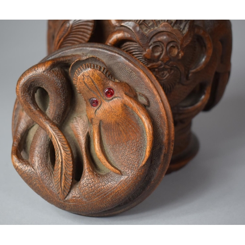 249 - A Carved Indonesian Wooden Tobacco/Caddy Box Decorated in High Relief with Dragons, 17cm high