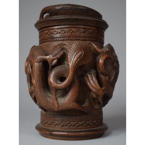 249 - A Carved Indonesian Wooden Tobacco/Caddy Box Decorated in High Relief with Dragons, 17cm high