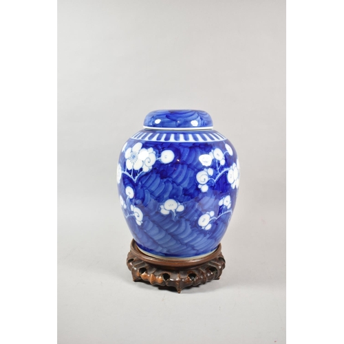 259 - A Good Pair of Large Oriental Prunus Pattern Ginger Jars with Covers on Pierced Wooden Stands, Four ... 