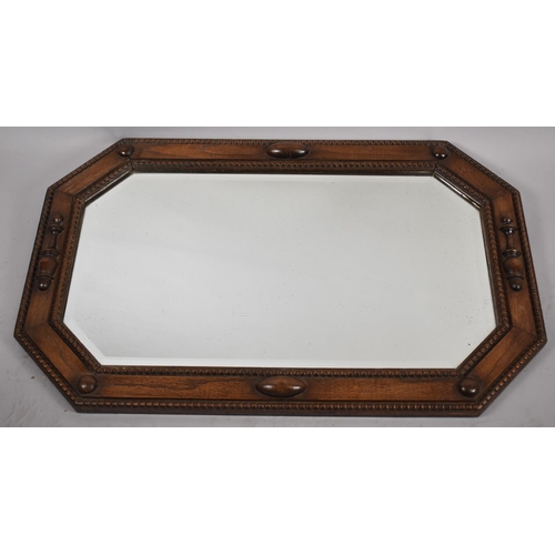 297 - An Edwardian Oak Framed Wall Mirror with Bevelled Glass, 89cm wide