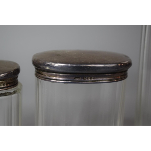 347 - Three Silver Topped Glass Dressing Table Pots