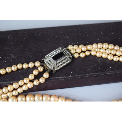 382 - A Late Victorian/Edwardian Three String Faux Pearl Necklace with Silver and Jet Clasp