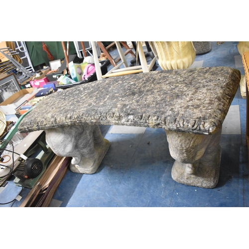 434 - A Reconstituted Stone Crescent Shaped Garden Seat on Elephant Supports, 108cm wide