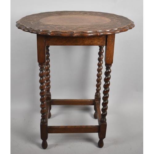 506 - An Edwardian Oak Oval Topped Occasional Table on Barley Twist Supports with Carved Border Depicting ... 