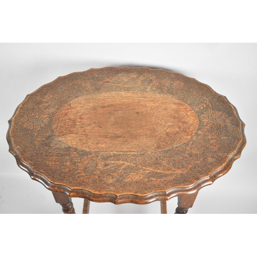 506 - An Edwardian Oak Oval Topped Occasional Table on Barley Twist Supports with Carved Border Depicting ... 