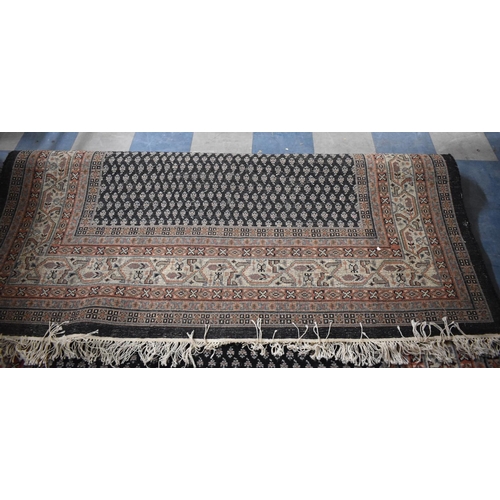 512 - A Patterned Woollen Rug, 295x200cm